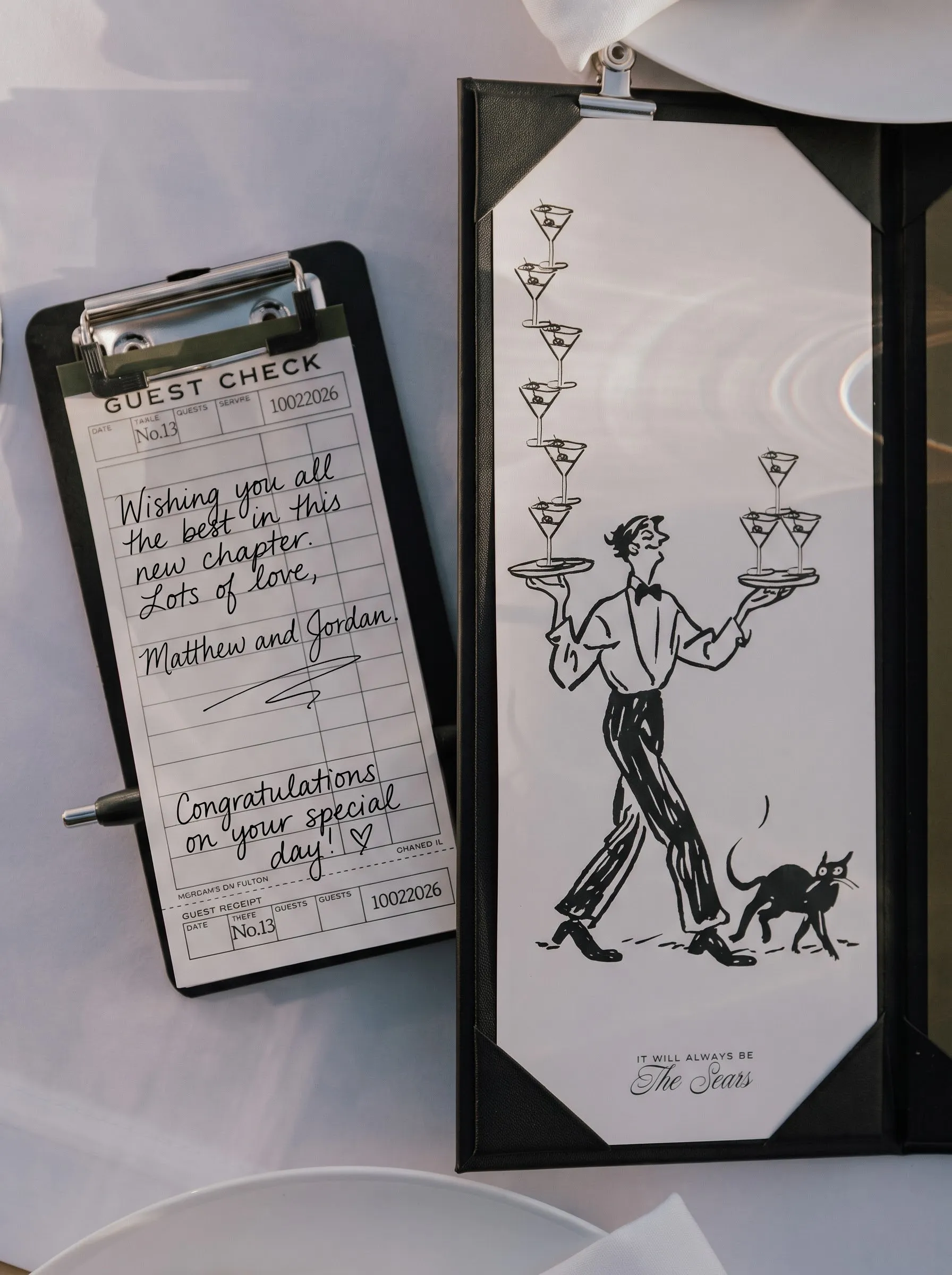 A signed guest check on a clipboard beside the bar menu, at the reception
